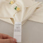 Dolce & Gabbana Elegant Off-White Silk Cardigan